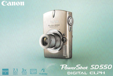 Canon SD-550 Scanned cover of box for Canon SD-550 showing a silver, point-and-shoot digital camera.
